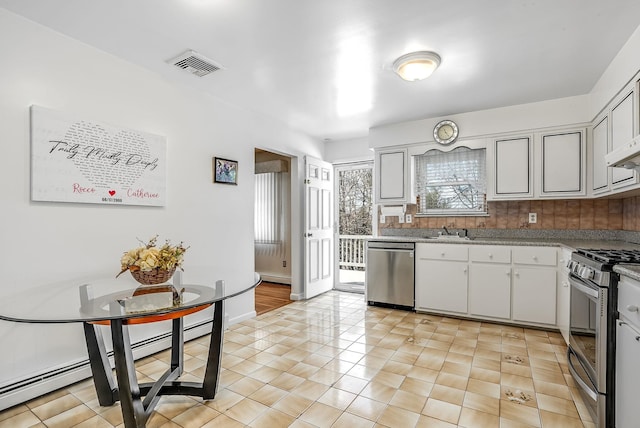 kitchen featuring sink, decorative backsplash, stainless steel appliances, and light tile patterned flooring