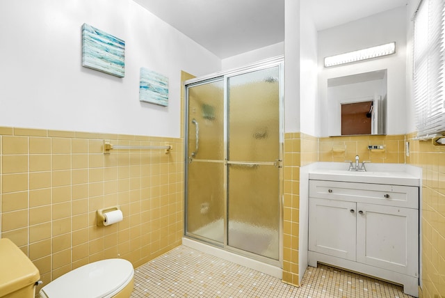 bathroom with walk in shower, tile patterned floors, toilet, and tile walls