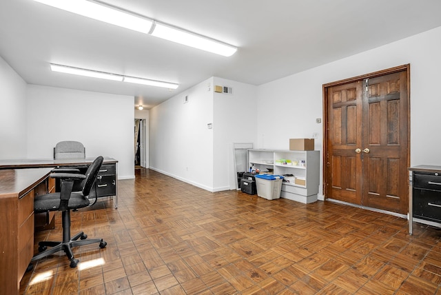 home office featuring dark parquet flooring