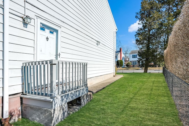 view of property exterior with a lawn