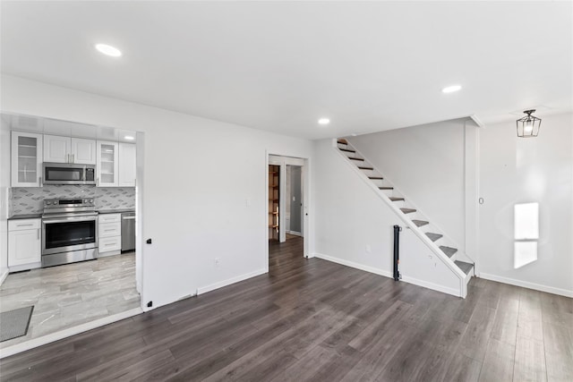 unfurnished living room featuring hardwood / wood-style floors