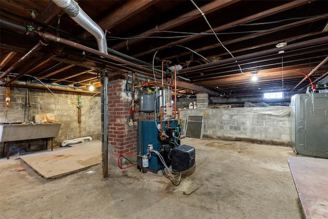 basement with sink and heating unit