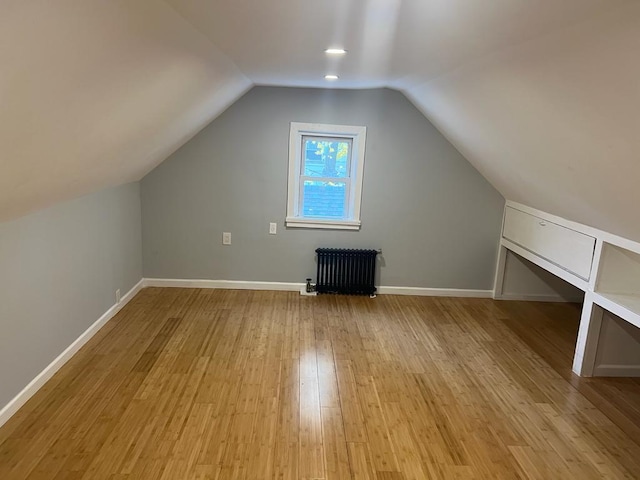 18806 Brinkerhoff Ave, Cambria Heights, NY 11412 - bonus room with lofted ceiling, radiator, and light hardwood / wood-style flooring