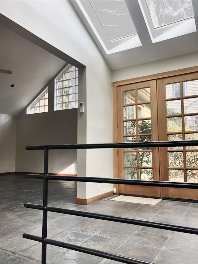 corridor featuring lofted ceiling