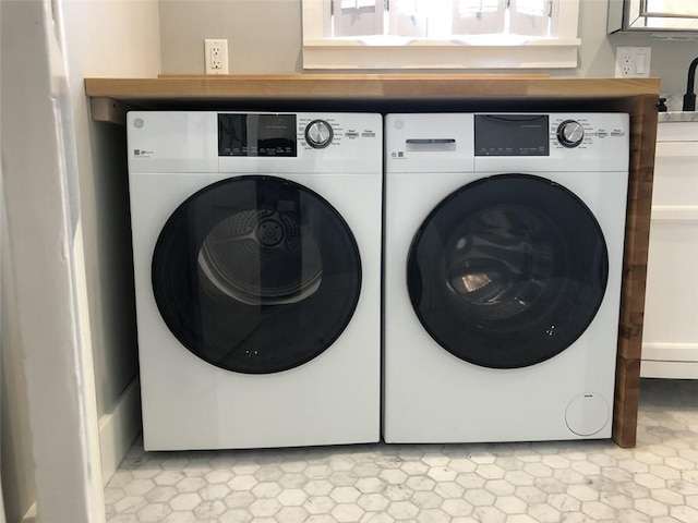 laundry area featuring washing machine and dryer