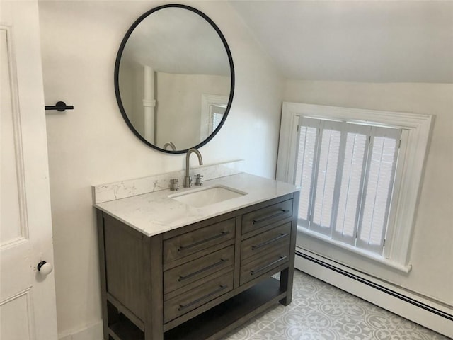 bathroom with vanity and baseboard heating