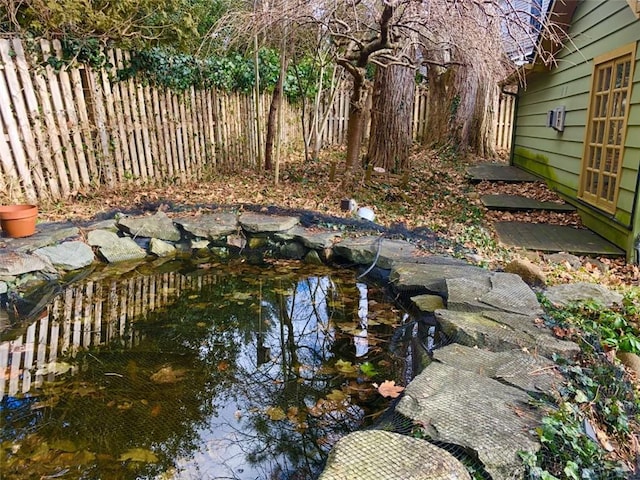 view of yard with a garden pond