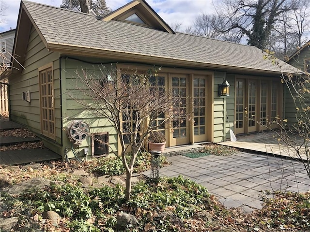 rear view of property featuring a patio area and french doors