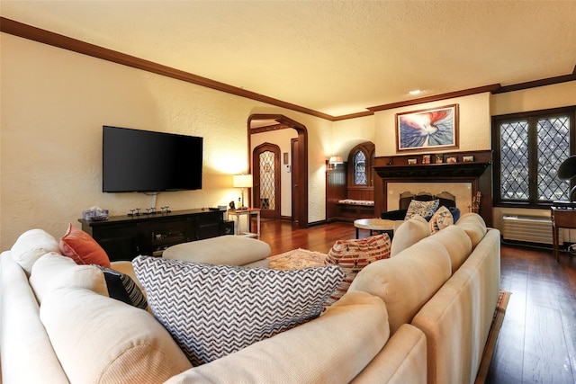 living room with dark wood-type flooring, crown molding, and a textured ceiling