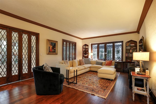 living room featuring crown molding, a textured ceiling, dark hardwood / wood-style flooring, and french doors