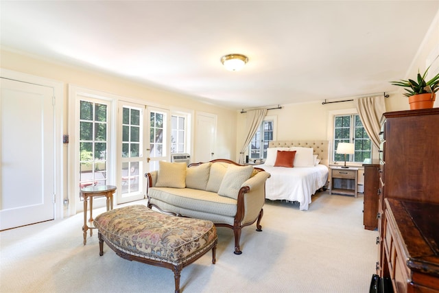 bedroom featuring light carpet and french doors