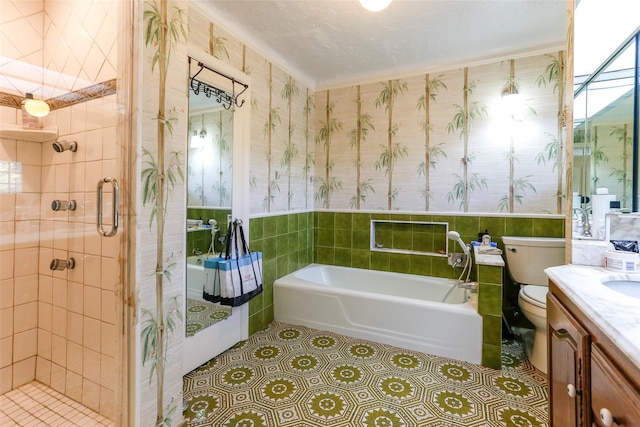 full bathroom with tile patterned floors, toilet, shower with separate bathtub, tile walls, and vanity