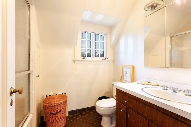 full bathroom featuring vanity, toilet, and combined bath / shower with glass door