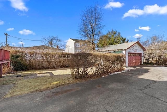 exterior space featuring an outbuilding and a garage