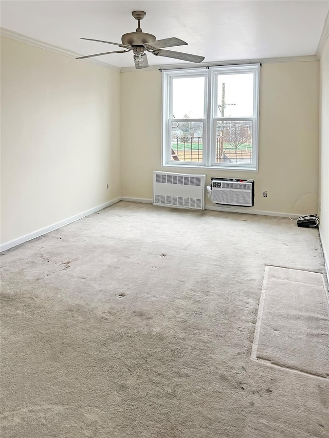 carpeted empty room with radiator, ornamental molding, a wall mounted AC, and ceiling fan