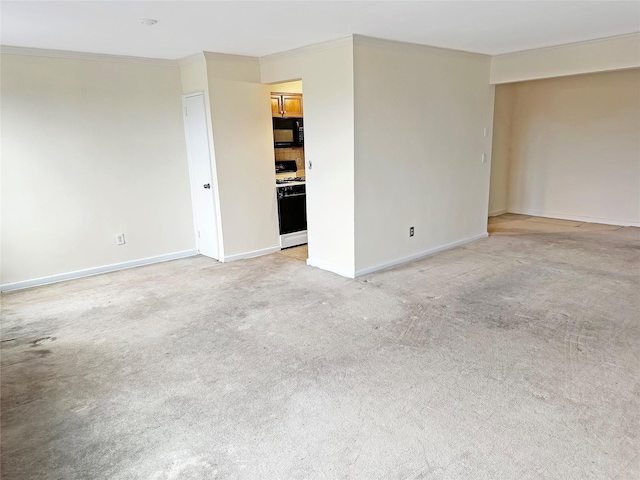 carpeted empty room featuring crown molding