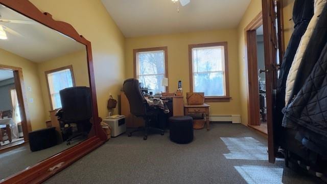 carpeted home office featuring lofted ceiling, ceiling fan, and baseboard heating