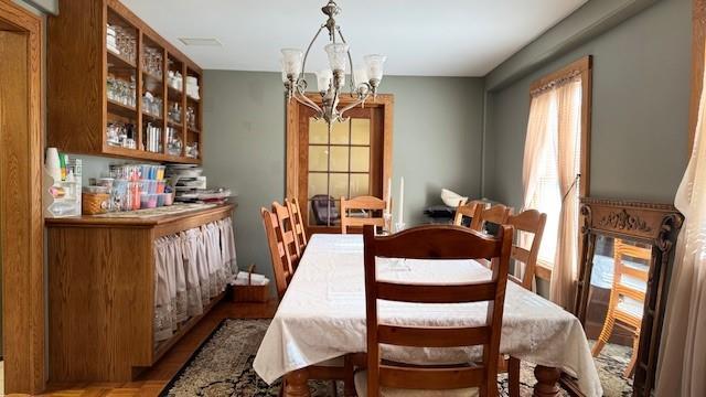 dining space featuring a notable chandelier