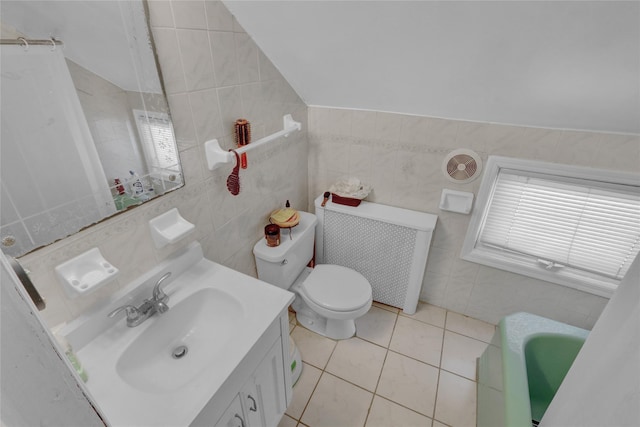 bathroom featuring tile patterned floors, toilet, tile walls, radiator heating unit, and vanity