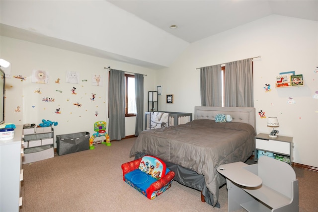 carpeted bedroom with vaulted ceiling