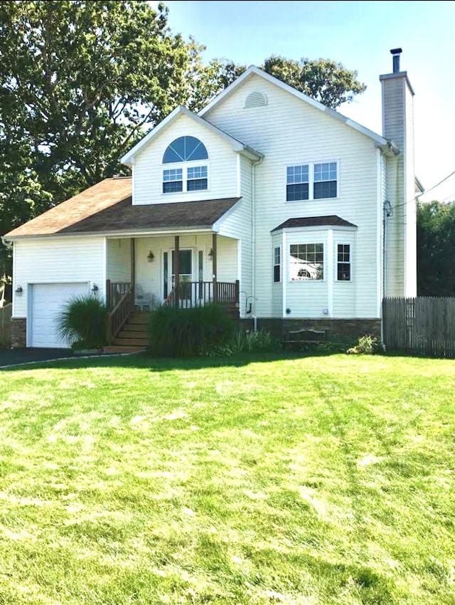 view of front of property featuring a garage, covered porch, and a front lawn