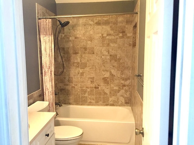 full bathroom featuring vanity, toilet, and shower / tub combo with curtain