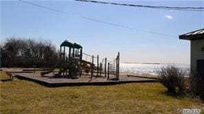 view of jungle gym featuring a lawn