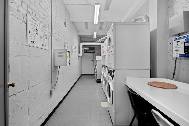 laundry room with stacked washer / drying machine