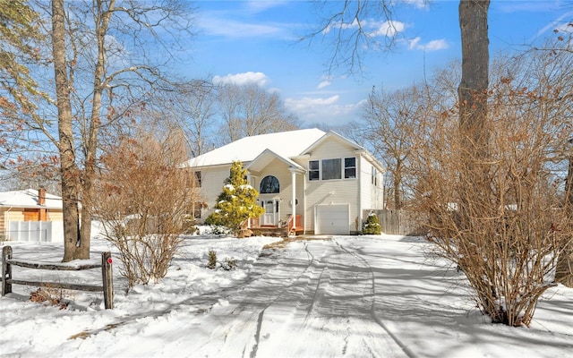 bi-level home featuring a garage