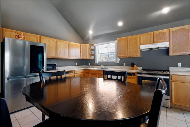 kitchen with lofted ceiling, sink, light tile patterned floors, stainless steel appliances, and light brown cabinets