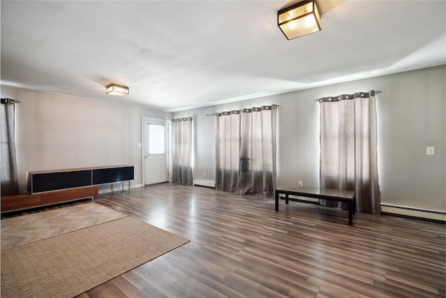 interior space with a baseboard radiator and dark hardwood / wood-style flooring