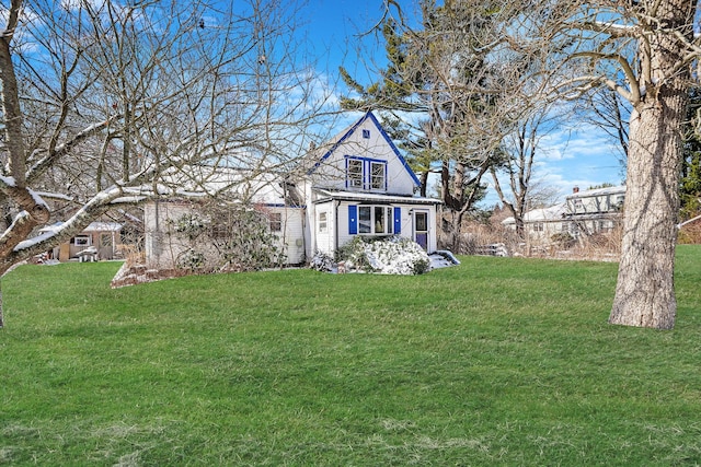 tudor house featuring a front yard