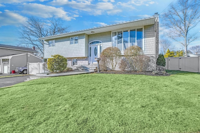 bi-level home with a front yard