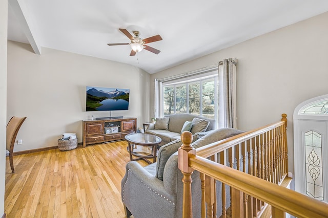 living room with hardwood / wood-style flooring and ceiling fan