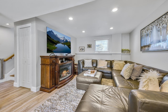 living room with light hardwood / wood-style flooring