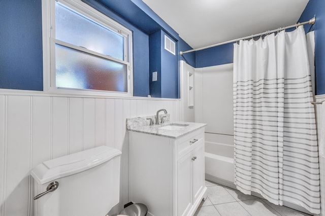 full bathroom with vanity, toilet, tile patterned floors, and shower / tub combo with curtain