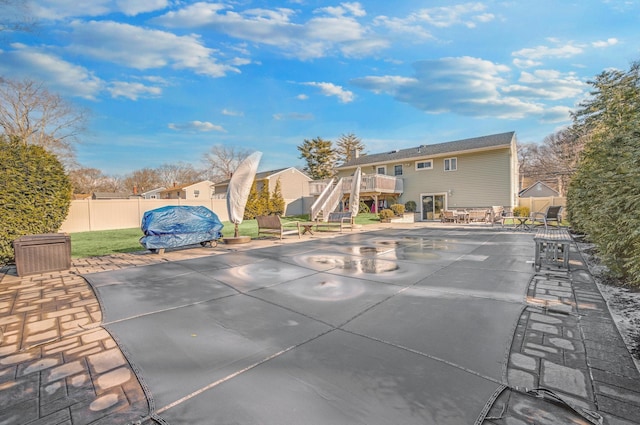 exterior space featuring a patio and a wooden deck