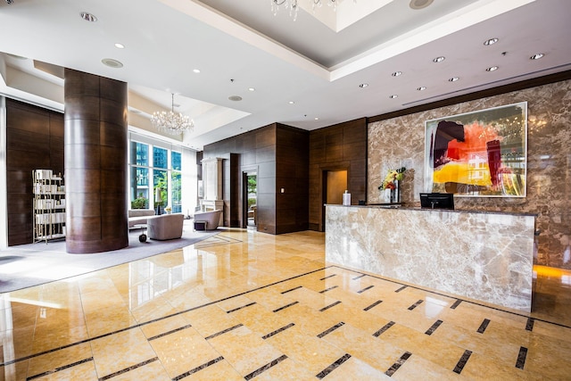 welcome area with a notable chandelier