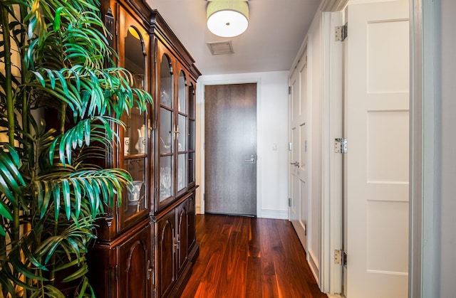 corridor with dark wood-type flooring