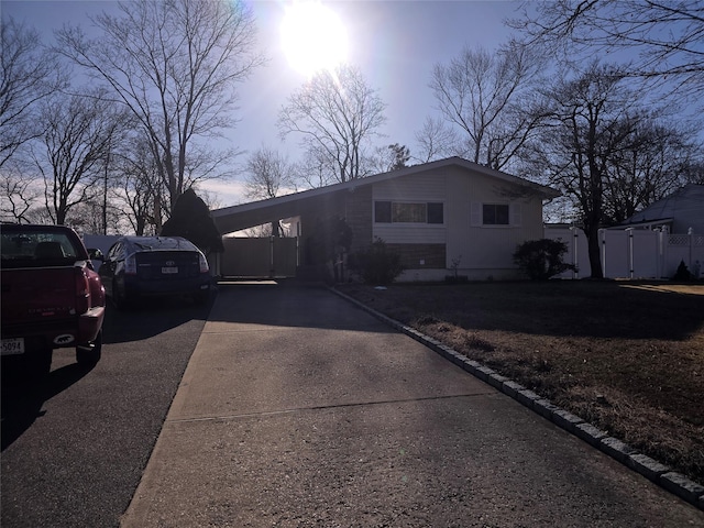 view of front of home with a carport