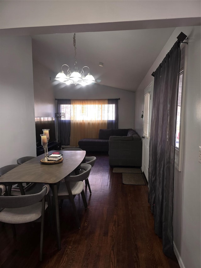 dining room featuring vaulted ceiling, a notable chandelier, and dark hardwood / wood-style flooring