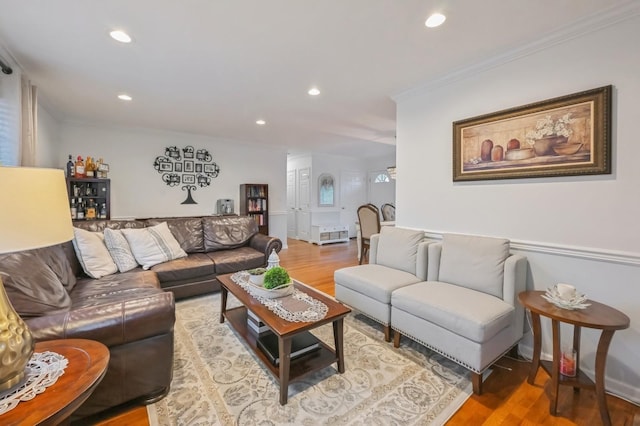 living room featuring hardwood / wood-style floors and ornamental molding