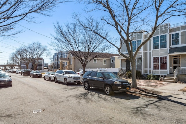 view of parking / parking lot with a residential view