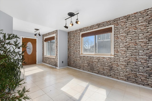 tiled entrance foyer with baseboards