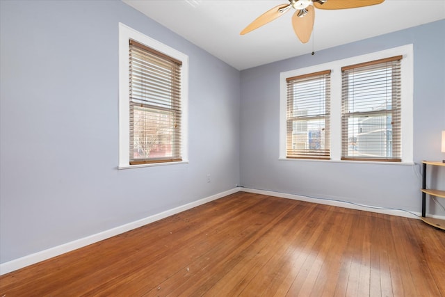 unfurnished room with ceiling fan, baseboards, and hardwood / wood-style floors