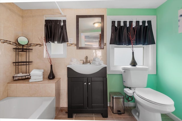 bathroom with baseboards, toilet, and vanity