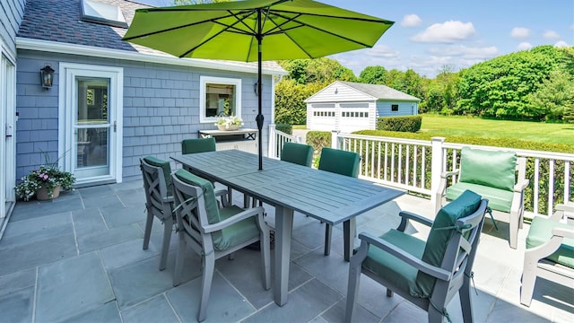 view of patio with a garage and an outdoor structure