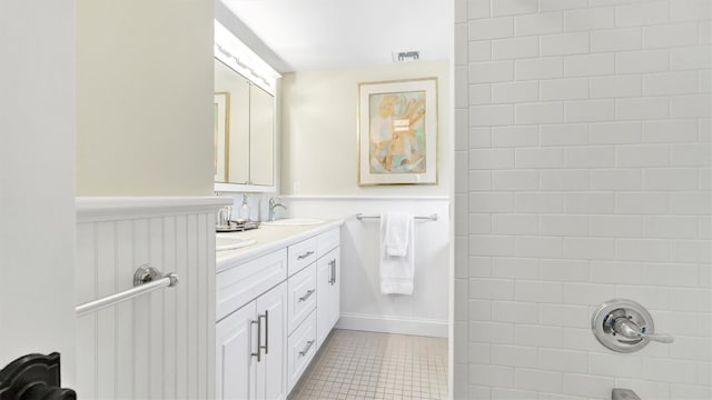 bathroom featuring tile patterned flooring and vanity