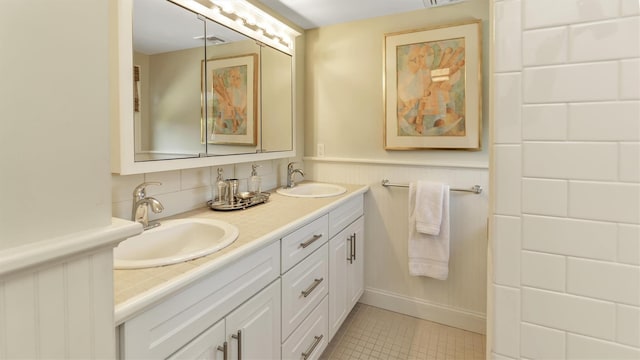 bathroom featuring tile patterned floors and vanity