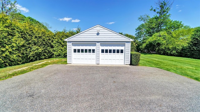 garage with a yard